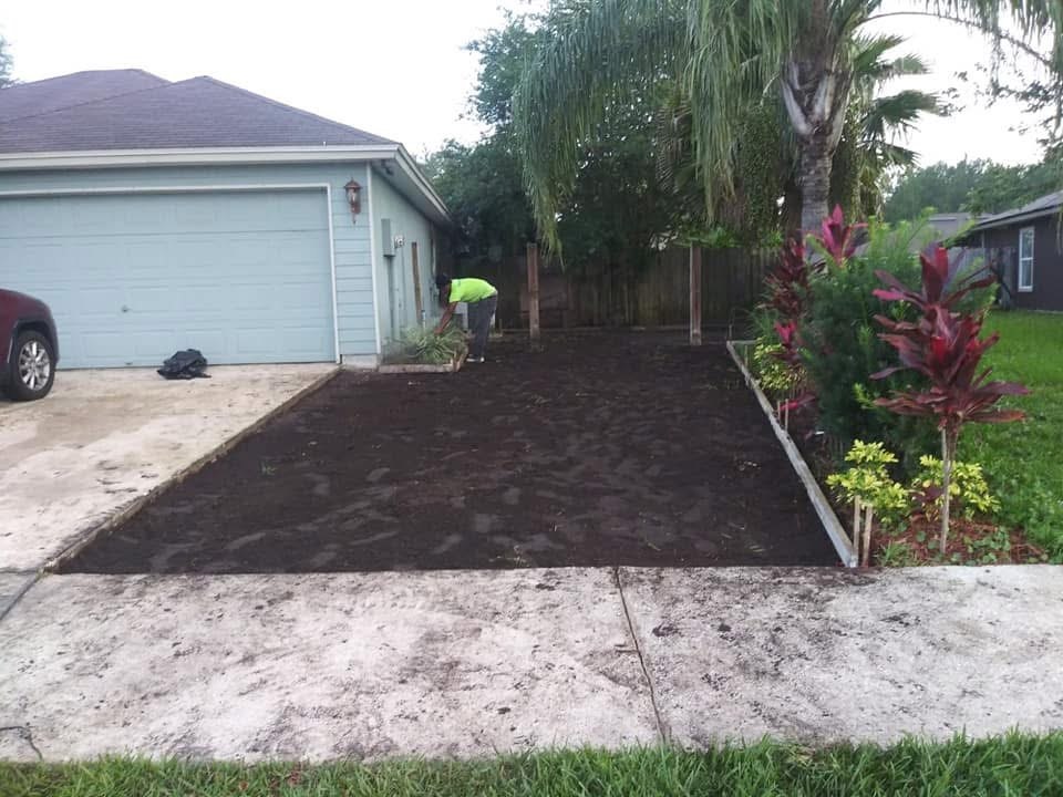 Prepared driveway area beside a residential garage